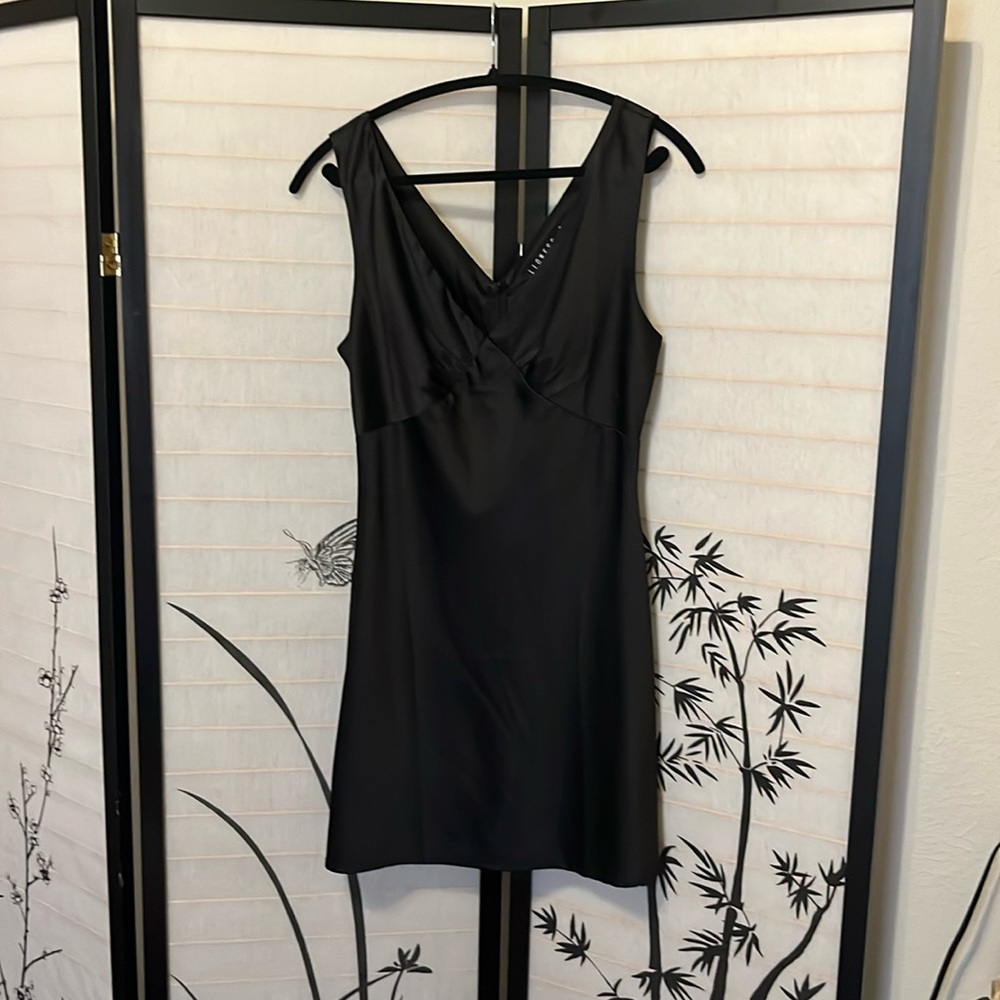 Black Lioness mini slip dress.